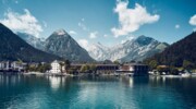 The Fürstenhaus on Lake Achensee, surrounded by trees and mountains.