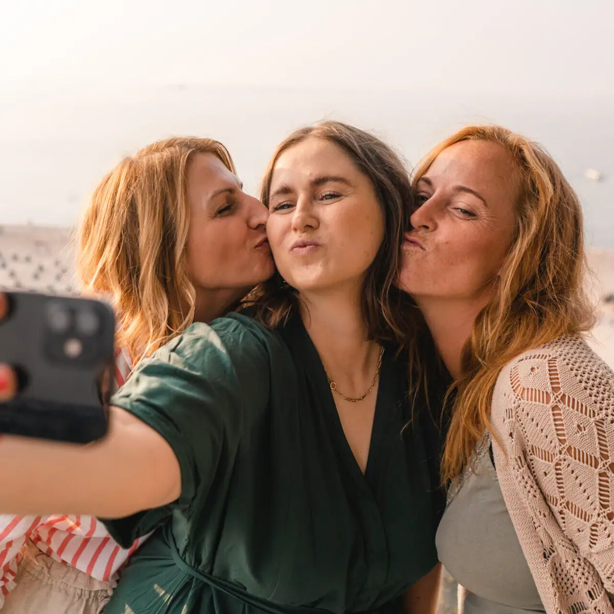 A group of women take a selfie.
