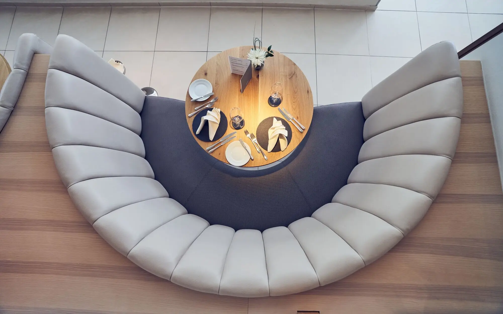 Table laid with plates and cutlery.