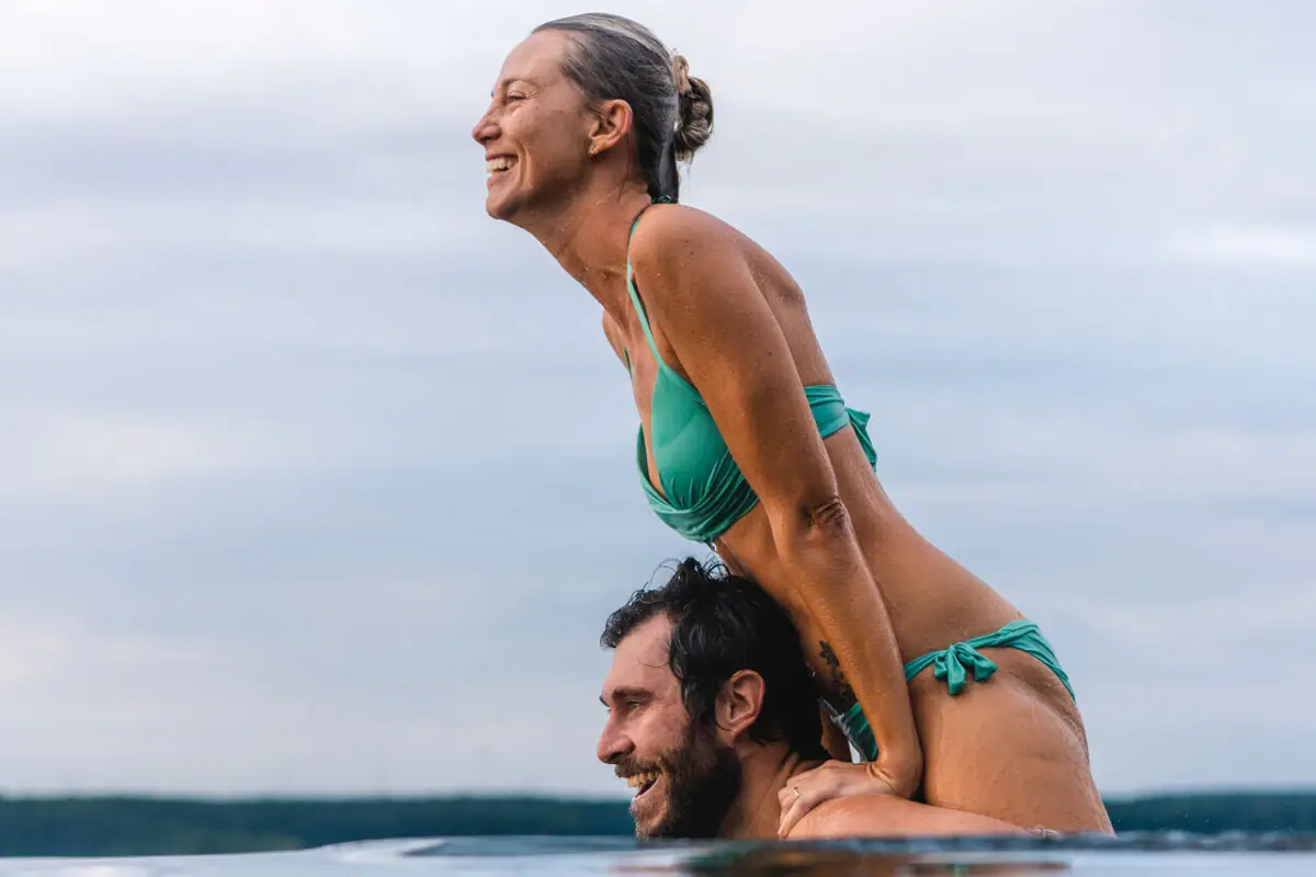 A man and a woman in the pool.