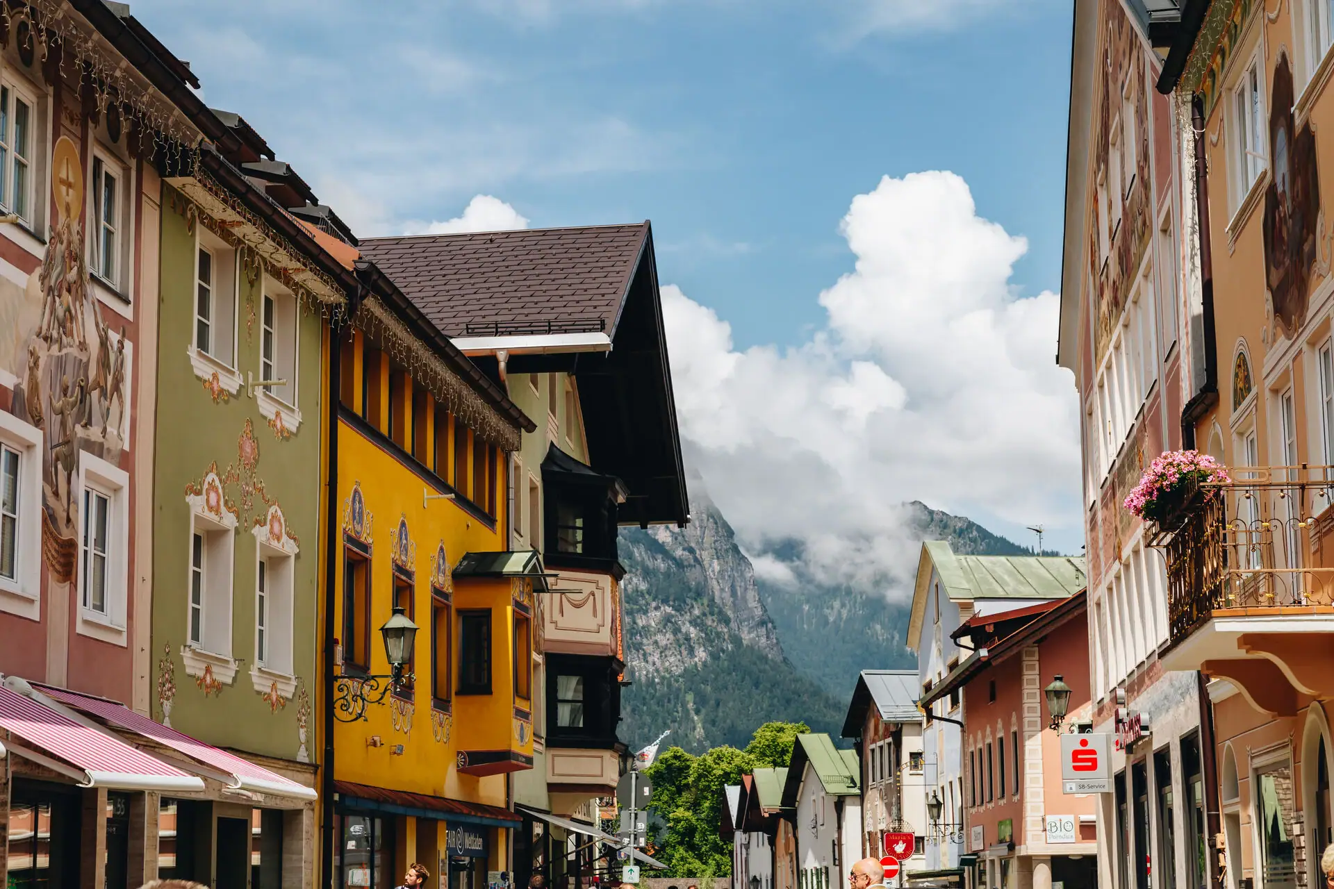 Road with buildings and mountains in the background.