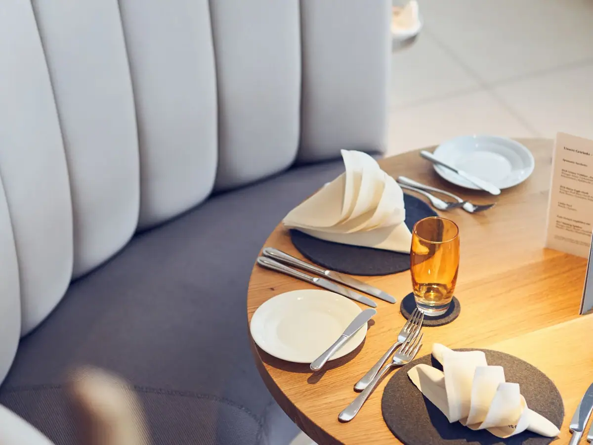 Restaurant table A table with plates and cutlery.