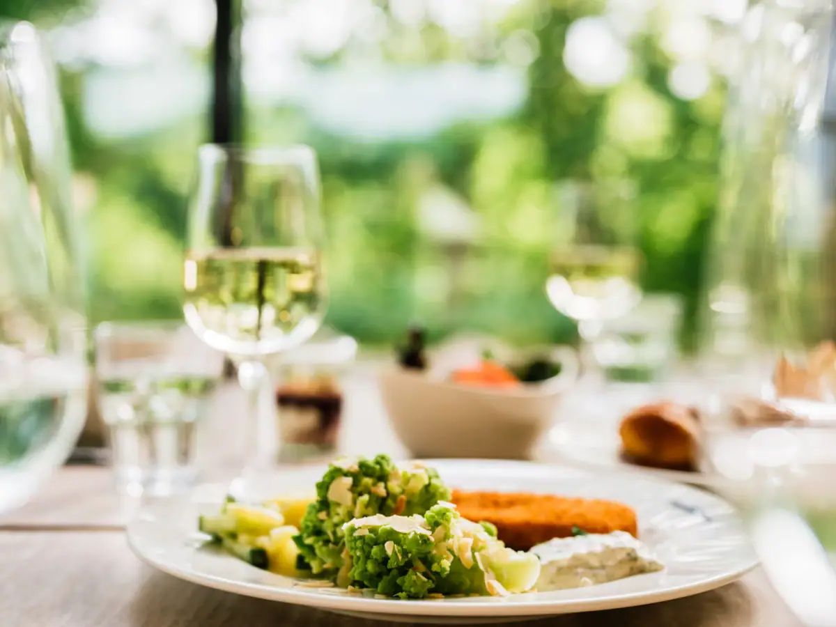 Restaurant aja Bad Saarow A plate of food and a glass of wine.