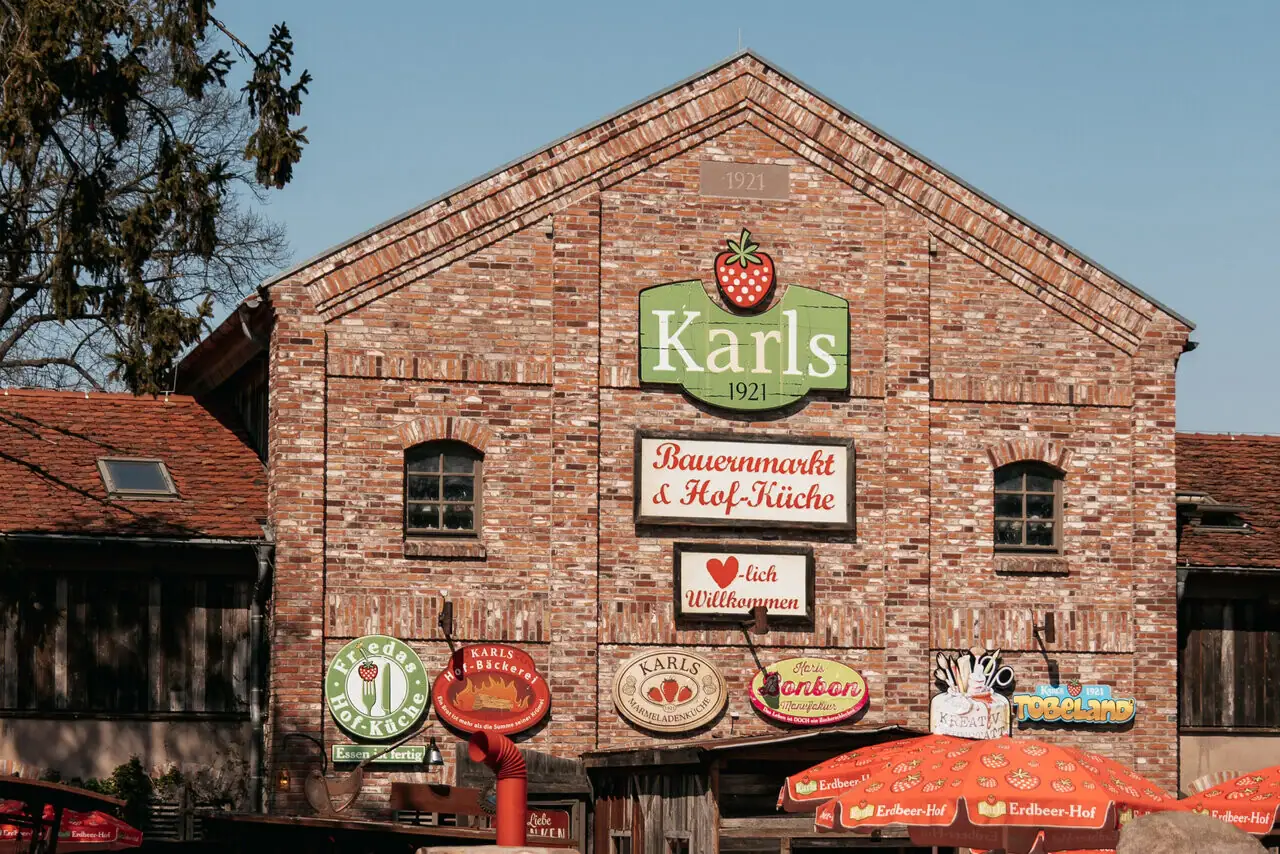 Karls Adventure Village Brick building with signs on the front