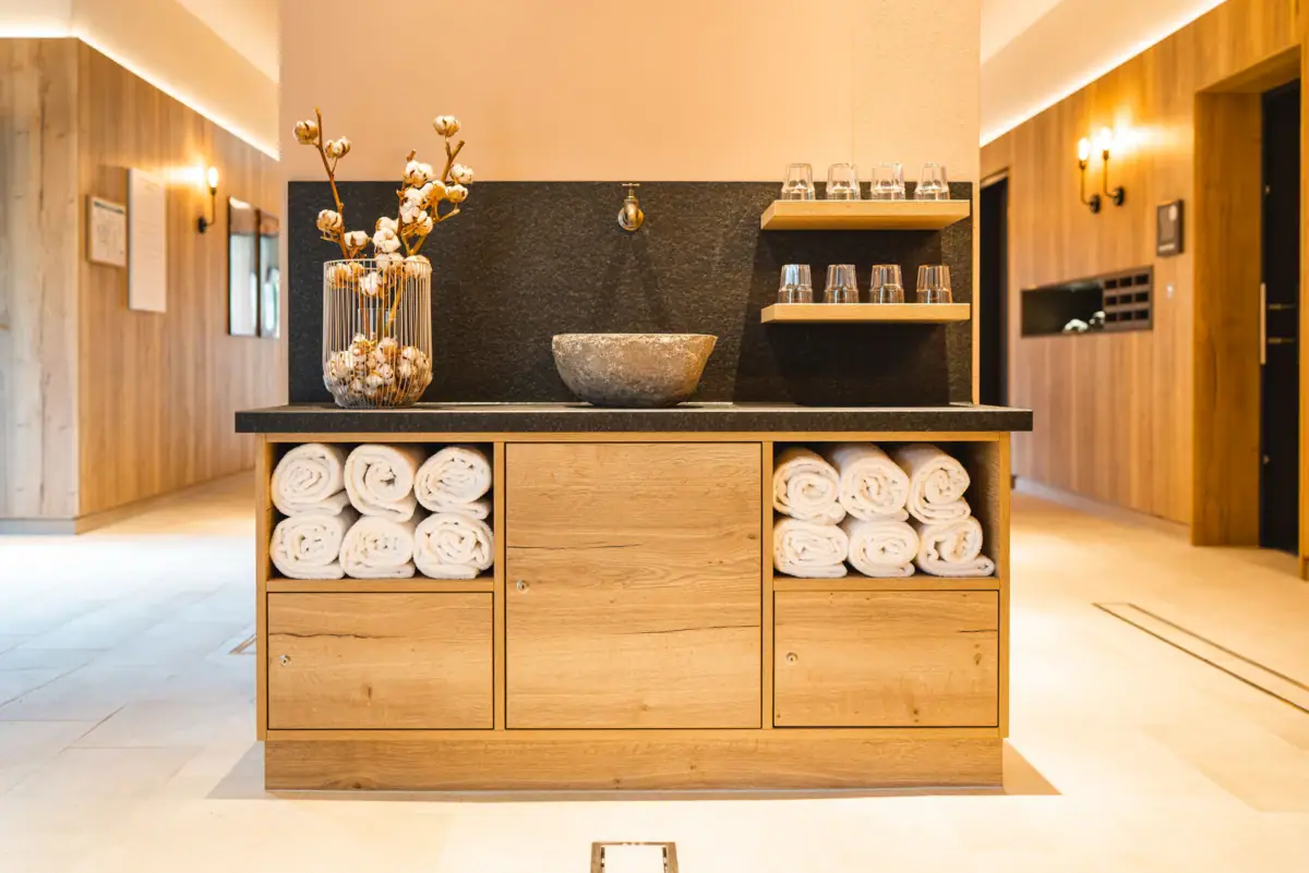 Sauna anteroom A bathroom with towels and washbasin.