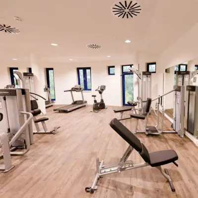 Gym at aja Warnemünde A room with fitness equipment.