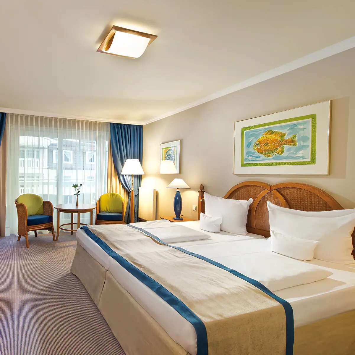 Hotel room with a bed and a desk.