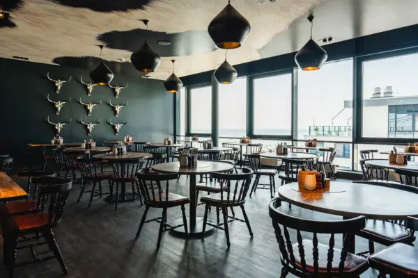 A room with tables and chairs.