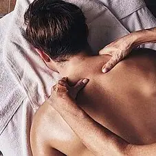 A man receives a back massage.