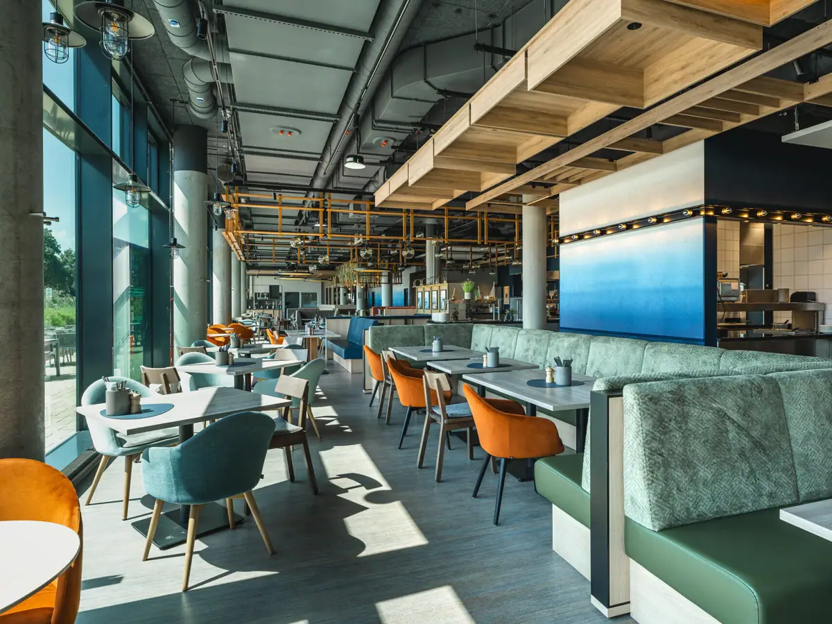 A restaurant with tables and chairs.