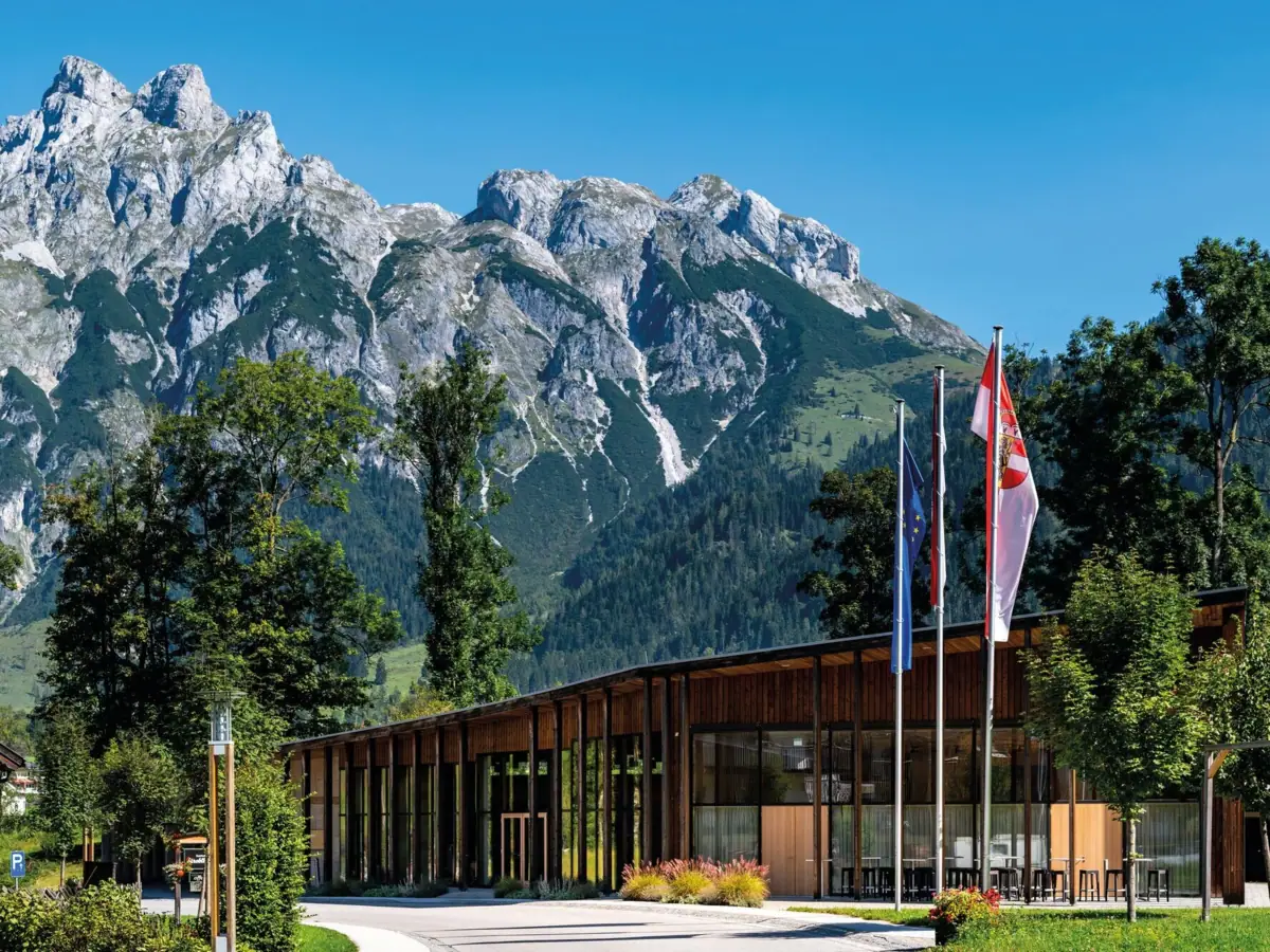 Conference centre Conference centre with flags against a mountain backdrop.