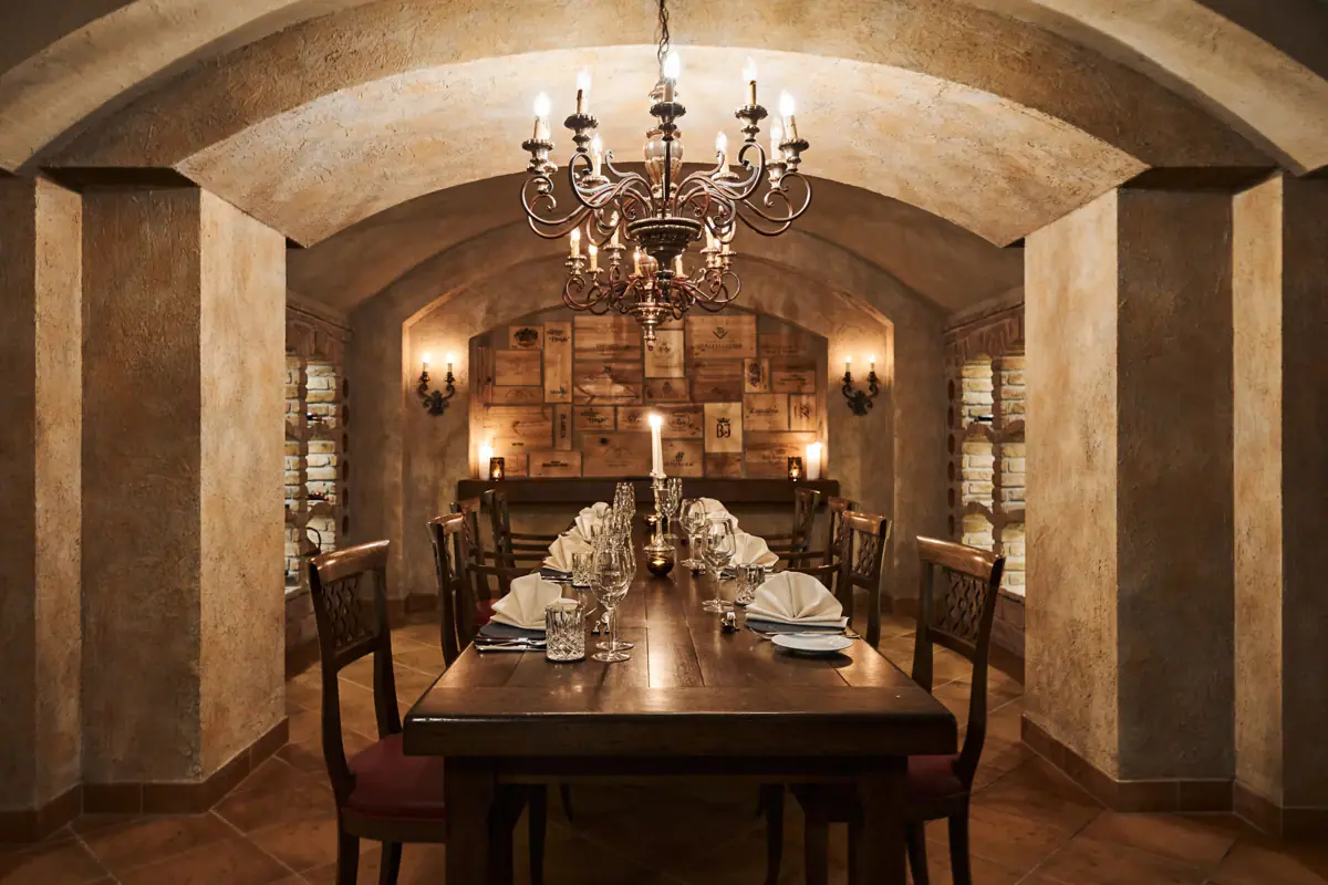 Dining table with candles and a chandelier