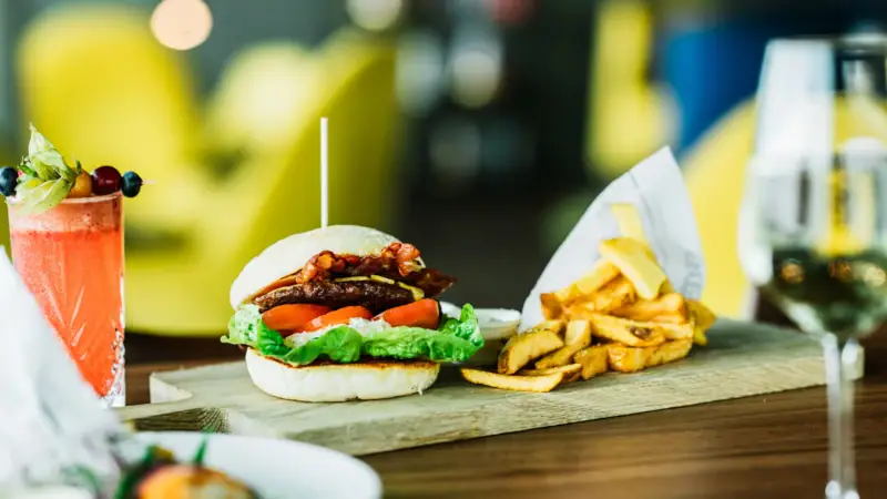 Burgers and fries on a cutting board