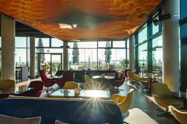 A room with tables and chairs.