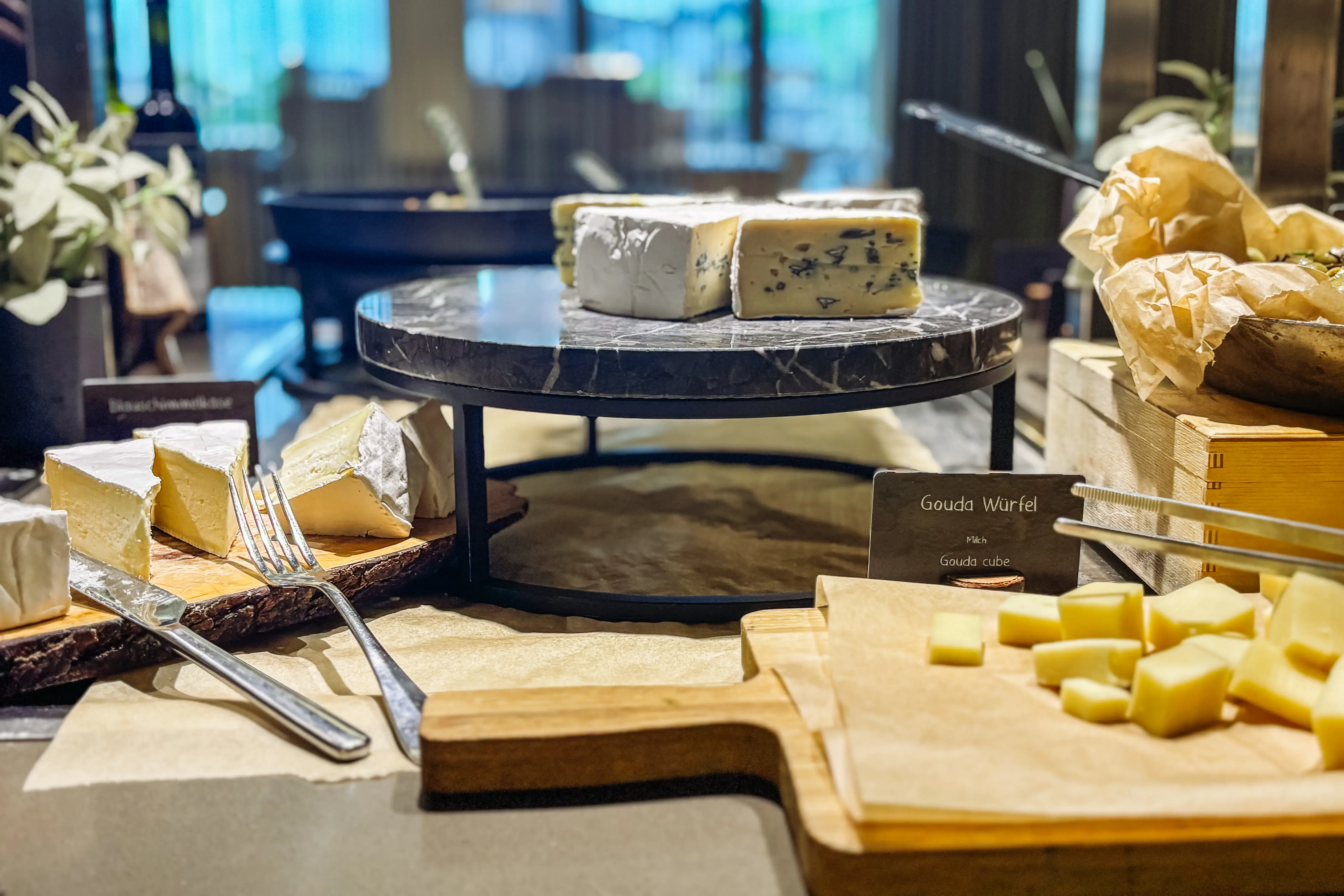 A table with different types of cheese.