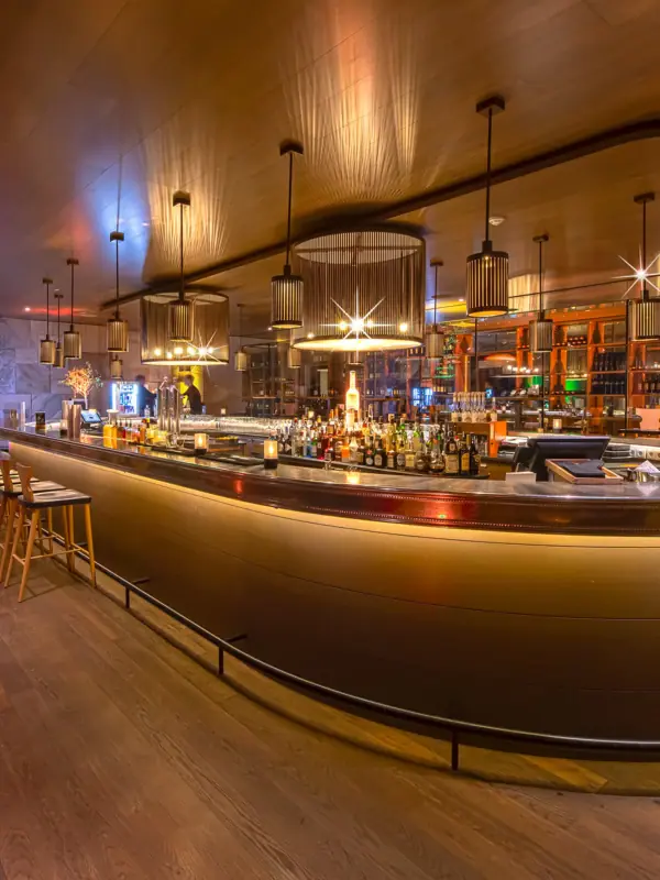 A bar with a bar counter and stools.