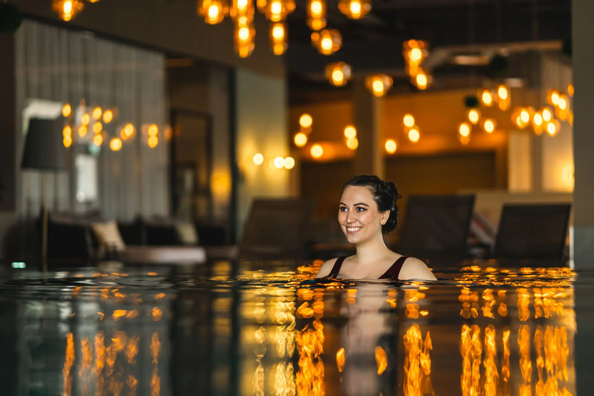 Indoor pool A woman smiles in a pool.