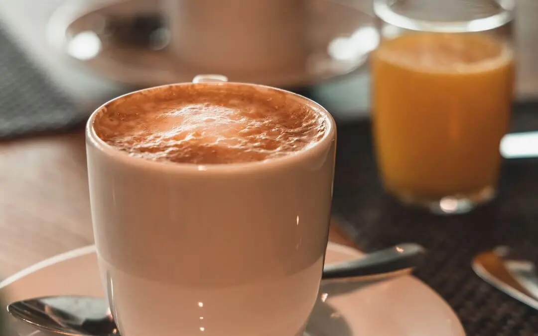 A cup of coffee on a saucer.