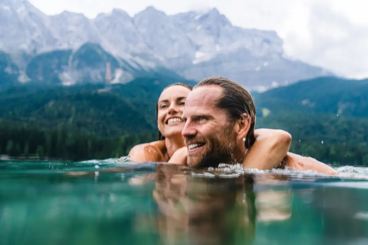 A man and a woman in the water.