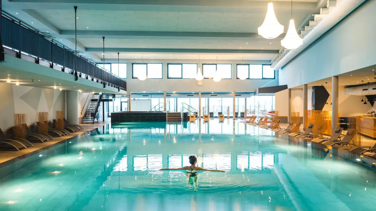 A woman in a swimming pool.