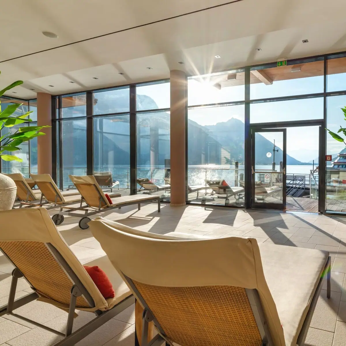 SPA with lake view A room with chairs and a large glass door.