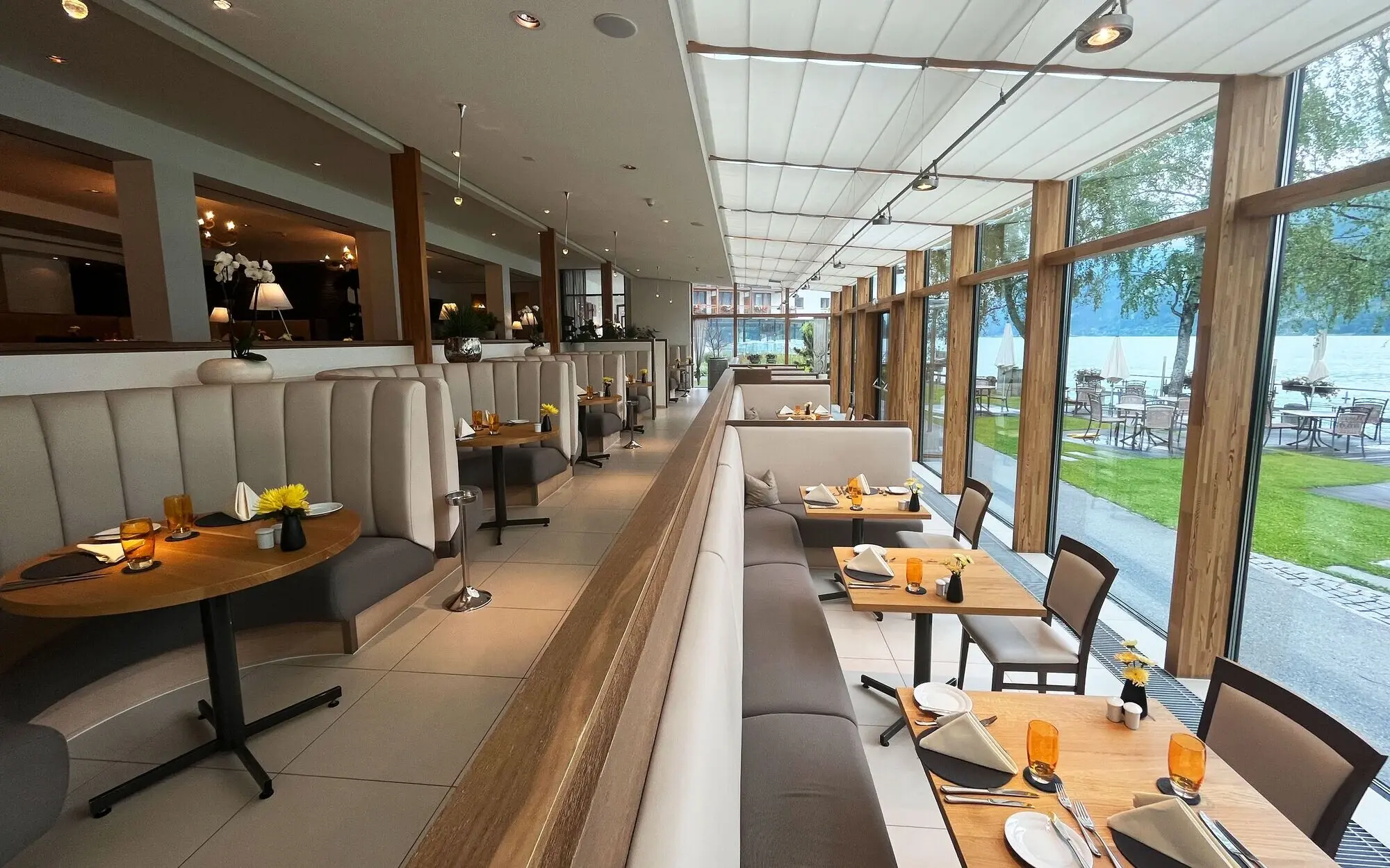 Interior view of a restaurant with tables and chairs.