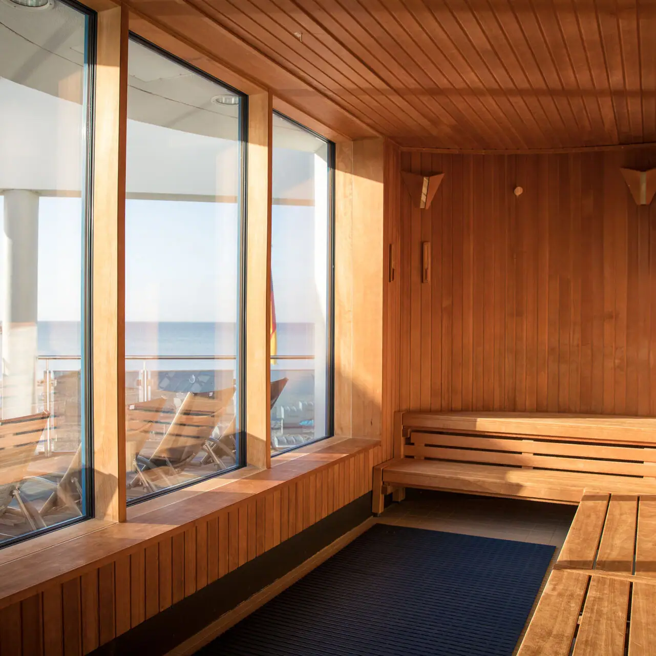 A room with wooden walls and windows.