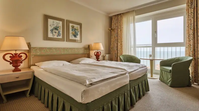 Hotel rooms Nordperd & Villas Hotel room with bed and window.