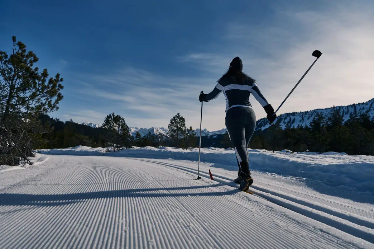 Cross-country skiing Person cross-country skiing on a snow-covered road.