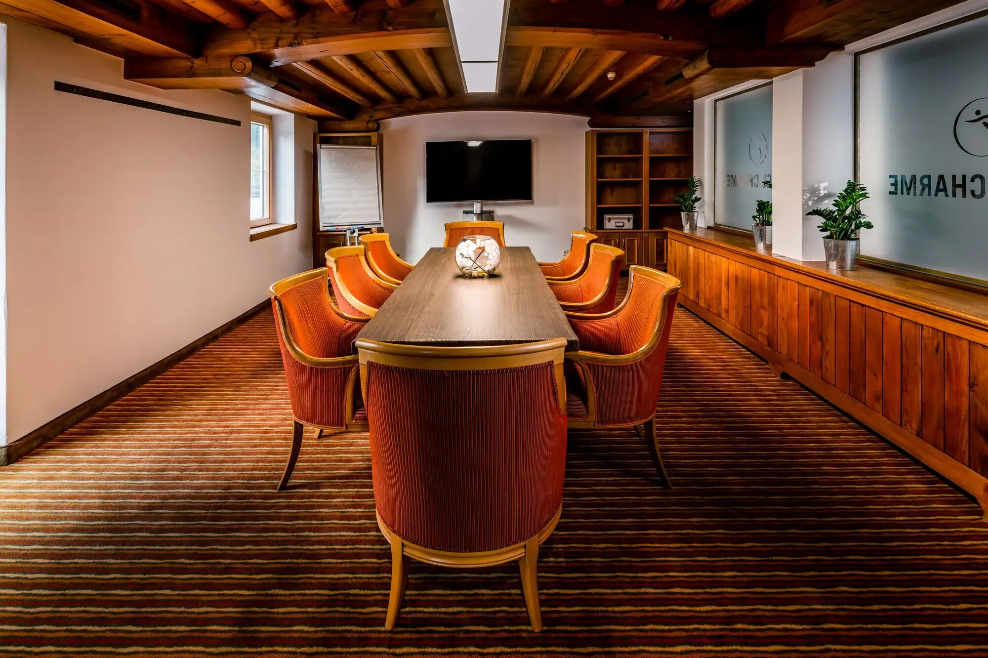 A room with a table and chairs.