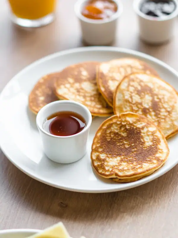 Pancakes A plate of pancakes and sauces on a table.