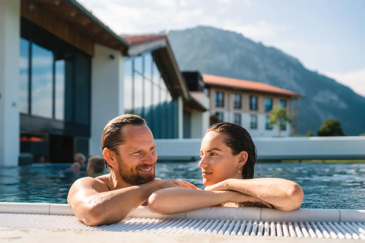 A man and a woman in a pool.