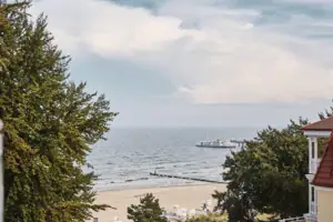 Boat on the water under a cloudy sky