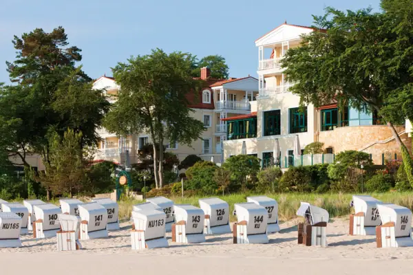 A group of boxes on a beach under a clear sky.