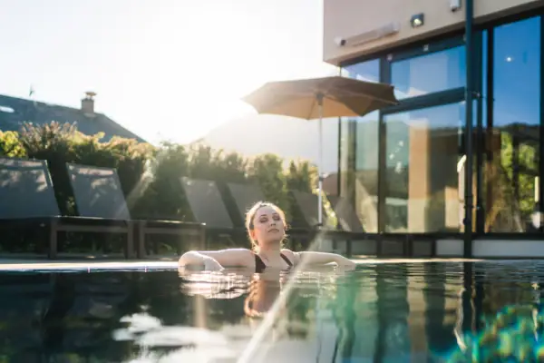 Outdoor pool A woman swims in an outdoor pool.
