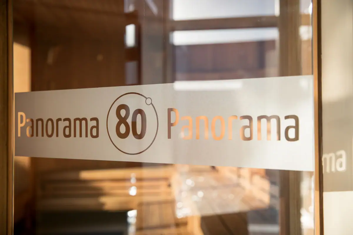 A sign on a glass door that reads Panorama