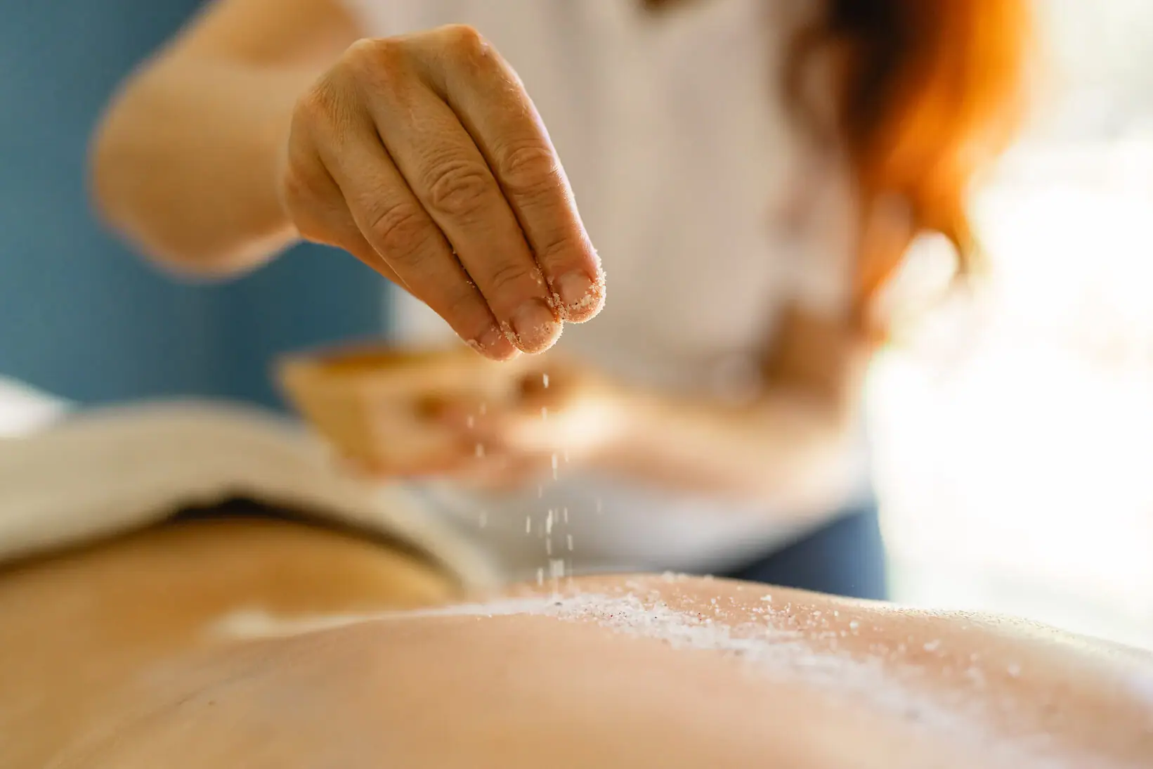 Tranquillity of the forest - combination One person sprinkles salt on the back of another person.