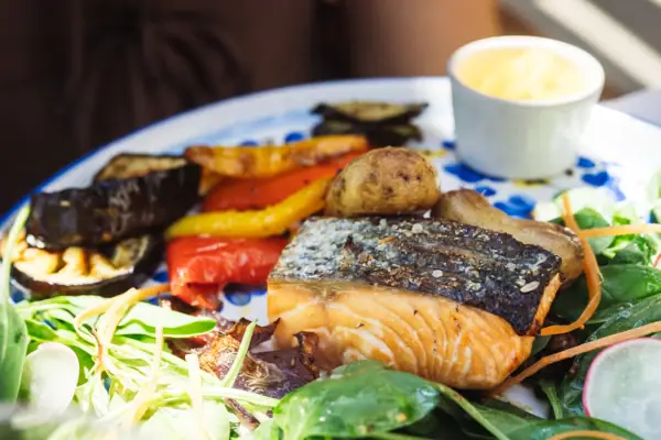 A plate with a dish and sauce.