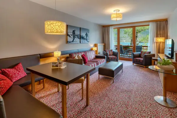 A room with a table and chairs.