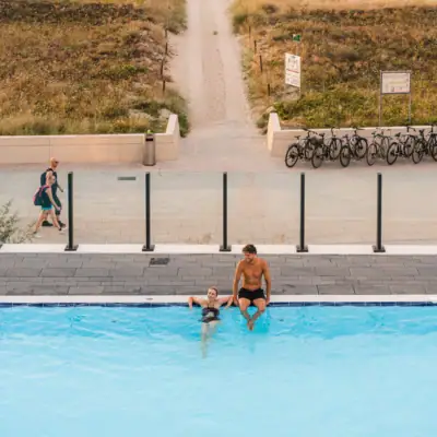 A group of people in a swimming pool.