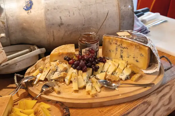 A plate of cheese and grapes.