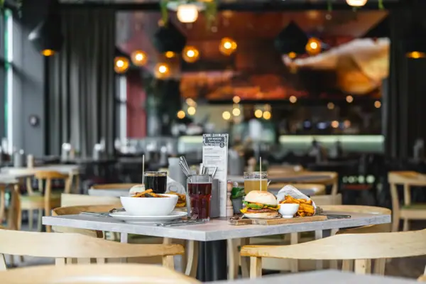 A table with various dishes and drinks.