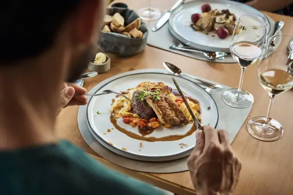 A person is eating at a table.