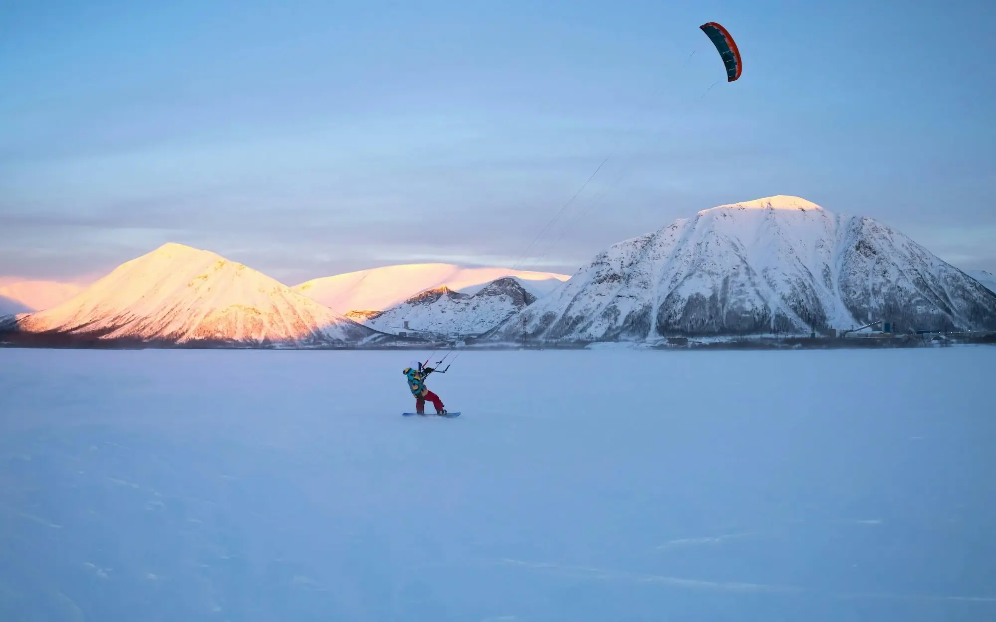 Person snowkiting on the snow-covered Achensee.