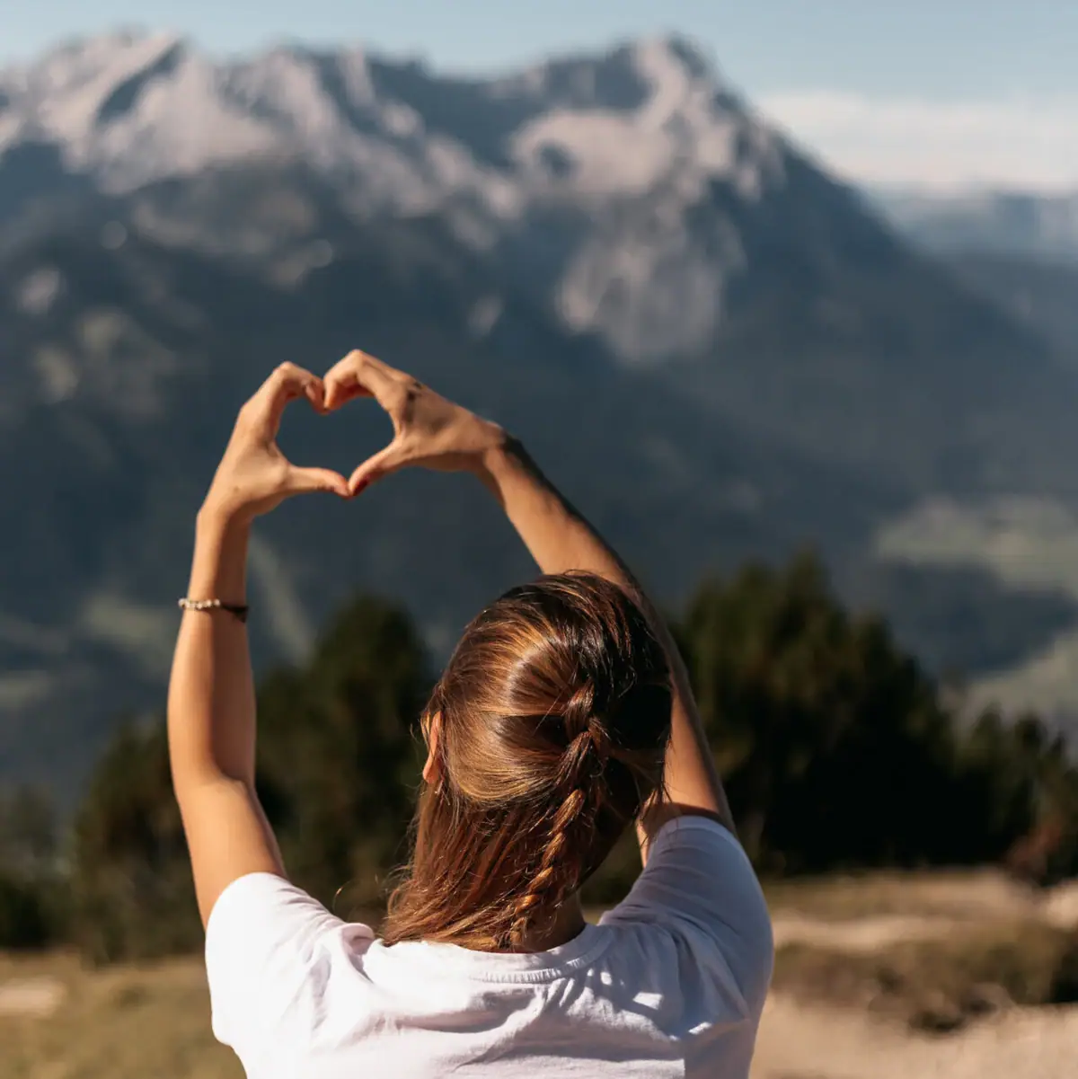 Heart A woman forms a heart with her hands.