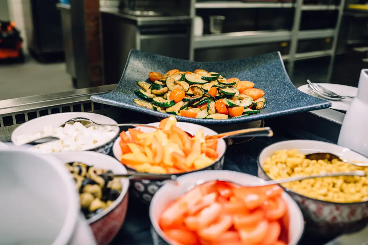 A group of bowls with various dishes.