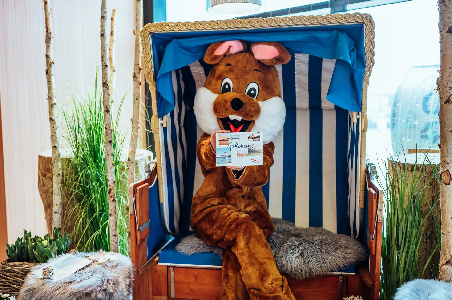 A person in a piece of clothing sits in a beach chair.