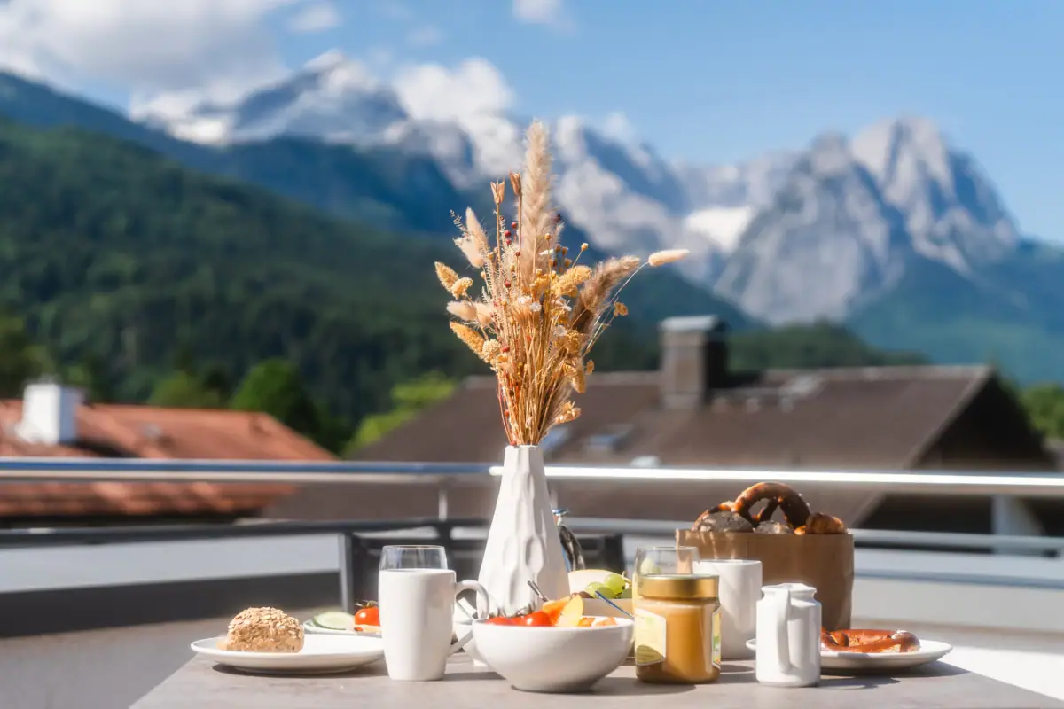 Breakfast A table with food and a vase with wheat on it.