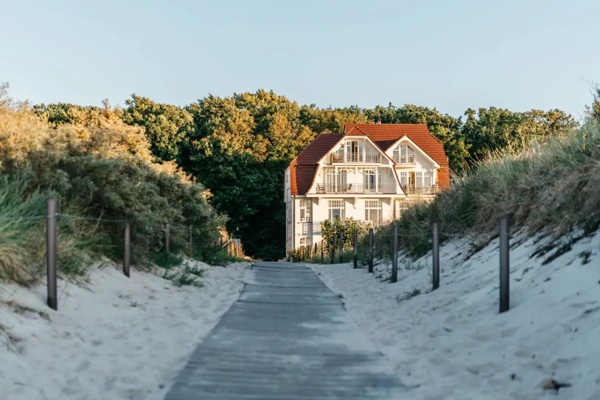 Beach approach Warnemünde A path that leads to a house.