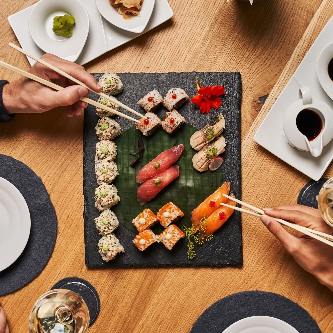 Sushi A group of people eating sushi.